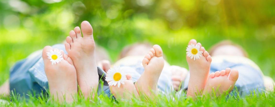 Feet in the grass on a sunny day