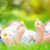 Feet in the grass on a sunny day